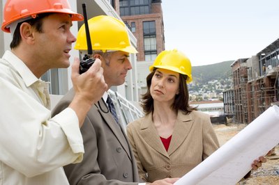 Jupiterimages/Pixland/Getty Images Civil construction supervisors work on homes and commercial buildings.