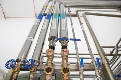 Jupiterimages/Comstock/Getty Images Pipefitters design and install pipes to carry water, gas and chemicals.