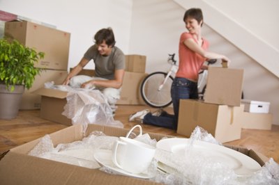 Jupiterimages/Goodshoot/Getty Images Buying a home involves considerable paperwork.