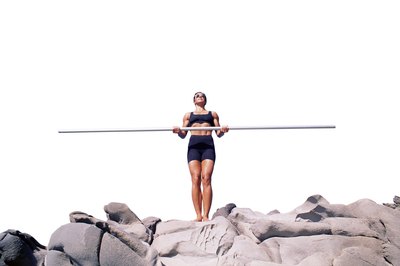 Jupiterimages/Photos.com/Getty Images Adding weight to your arm movements creates muscle definition.