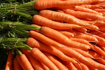 Hemera Technologies/AbleStock.com/Getty Images Carrots are relatively high in some carbs, but low in usable sugar.