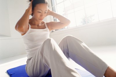 George Doyle/Stockbyte/Getty Images Exercise in the privacy of your home so you can show off your flat abs outside.