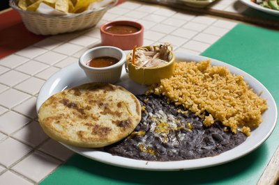 Todd Warnock/Lifesize/Getty Images Black beans and rice are high in fiber.
