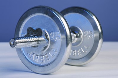 Hemera Technologies/AbleStock.com/Getty Images The dumbbell -- your new best weight loss buddy.