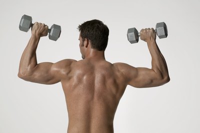 Photodisc/Photodisc/Getty Images Exercising with strained muscles can harm your muscles.