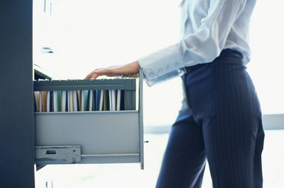 George Doyle/Stockbyte/Getty Images Communication policies help prevent unauthorized access to confidential data.