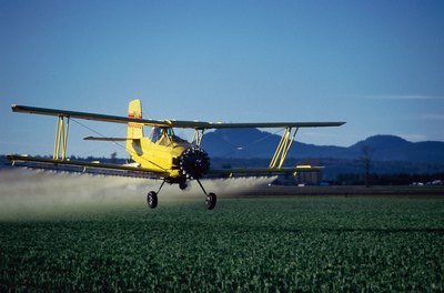 Jupiterimages/liquidlibrary/Getty Images Being a spray plane pilot means spending a lot of time alone as you sweep the fields.