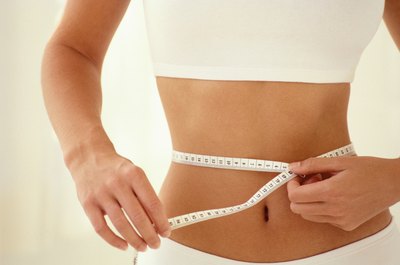 Pixland/Pixland/Getty Images Lose inches with healthy foods and plenty of exercise.