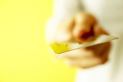 Jupiterimages/Photos.com/Getty Images Credit cards can be convenient but the resulting debt could lead to financial stress.