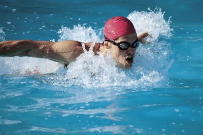 Comstock/Comstock/Getty Images Keeping your wrists straight, flexed or relaxed can have a huge impact on your overall stroke technique.