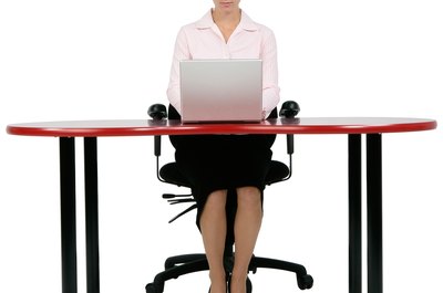 PhotoObjects.net/PhotoObjects.net/Getty Images Take a break and exercise in your chair to increase your energy level.