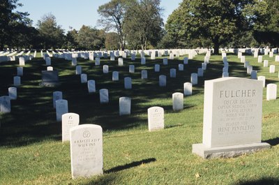 Tom Brakefield/Stockbyte/Getty Images Gravediggers who work in federally owned cemeteries earn over $46,000 annually.