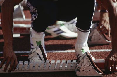 Gary Faber/Photodisc/Getty Images Compression socks can propel running performance.