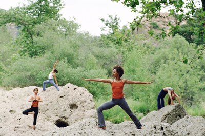 Mike Powell/Digital Vision/Getty Images Yoga poses engage the legs for strength and balance.