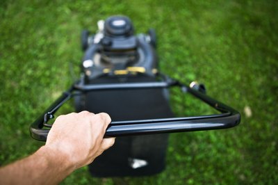 Jupiterimages/Photos.com/Getty Images Mowing is always a part of the groundskeeper's role.