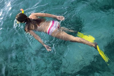 ITStock/Polka Dot/Getty Images Finning requires different leg motions than those used in standard swimming.