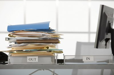 Comstock Images/Comstock/Getty Images Job termination may be voluntary or involuntary.