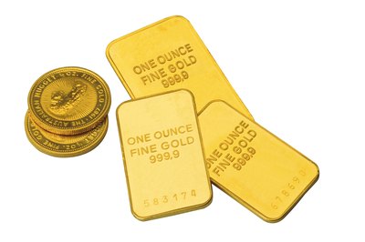 Comstock/Comstock/Getty Images Buying gold in bars and coins from an individual is a private gold purchase.