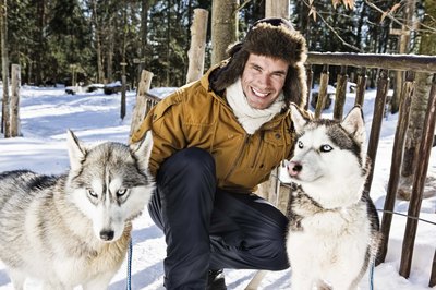 Jupiterimages/Brand X Pictures/Getty Images Their double coats help keep them warm, but your husky will still burn extra calories in very cold, wintry conditions.
