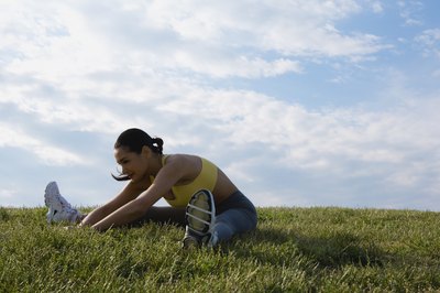 Comstock Images/Comstock/Getty Images Stretching helps improve range of motion, but doesn't change muscle length.