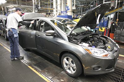 Bill Pugliano/Getty Images News/Getty Images Production supervisors are responsible for meeting product output goals.