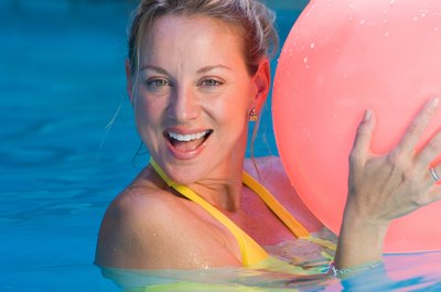 Jupiterimages/Photos.com/Getty Images Exercising in the pool is a low-impact activity.