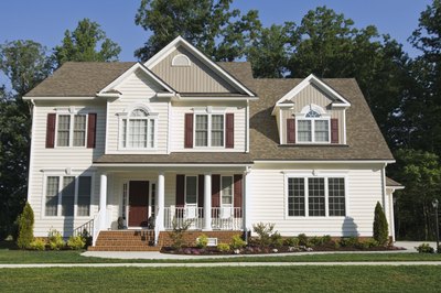 Jupiterimages/Comstock/Getty Images Lenders will approve two mortgages if you can afford to pay them.