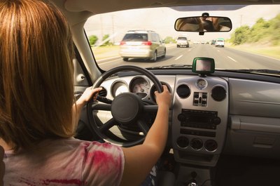 Jupiterimages/Creatas/Getty Images You can use proceeds from a refinancing to pay off your car.