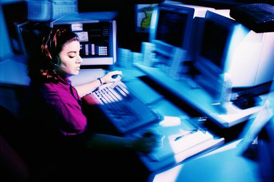 Thinkstock/Comstock/Getty Images Police dispatchers rely on computers to send help.