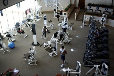 Chris Clinton/Photodisc/Getty Images Shape and sculpt your leg muscles on a cable cross machine.