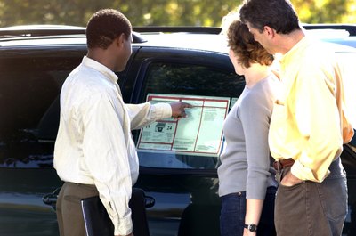 Thinkstock Images/Comstock/Getty Images Car dealers often use misleading tactics to get customers to make a purchase.