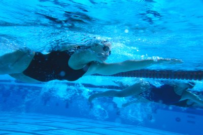George Doyle/Stockbyte/Getty Images Focusing on speed, technique and endurance provides a solid workout for an advanced swimmer.