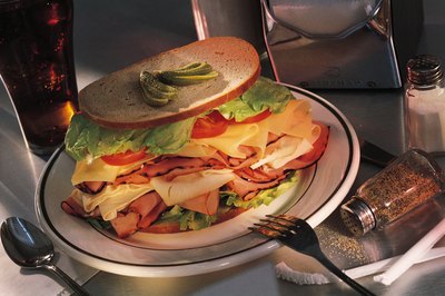 Comstock/Comstock/Getty Images Loading up on calories can bring on the bloat.