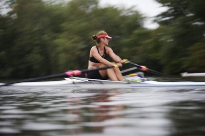 Jupiterimages/Comstock/Getty Images Rowing provides a full-body cardio workout.