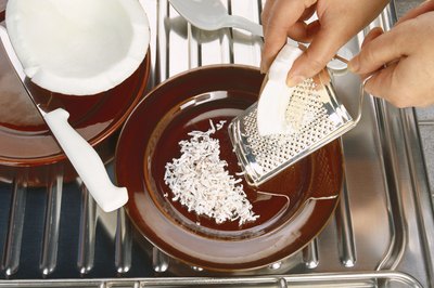 Stockbyte/Stockbyte/Getty Images Coconut adds carbs to coconut creme pie.