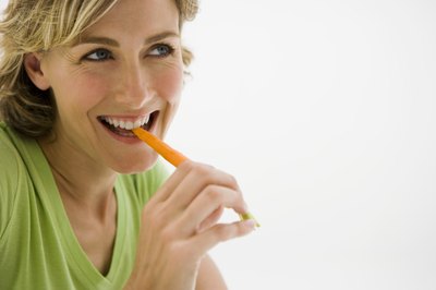 Jupiterimages/Pixland/Getty Images Eating healthy snacks can help keep blood sugar in check and promote overall health.