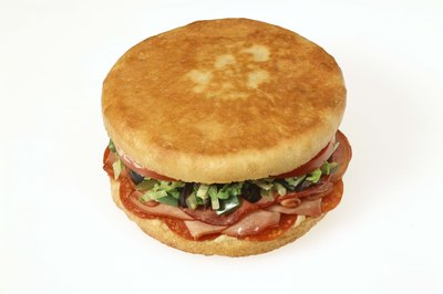 Jupiterimages/Comstock/Getty Images Luncheon meat may increase your cholesterol.