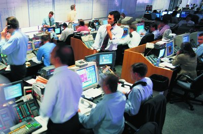 Stockbyte/Stockbyte/Getty Images Bond trading desks in financial centers handle billions of dollars in transactions daily.