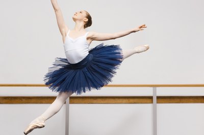 Jupiterimages/Pixland/Getty Images A ballet dancer requires a well-balanced diet to achieve her highest potential.