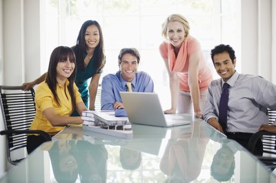 Brand X Pictures/Brand X Pictures/Getty Images Clubs in the workplace are great morale-builders.