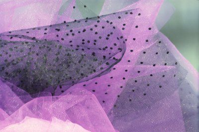 Jupiterimages/liquidlibrary/Getty Images Use tulle in a variety of colors and patterns to create custom looks.