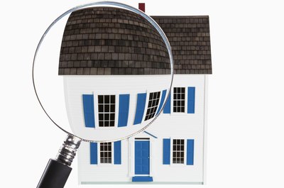 Jupiterimages/Comstock/Getty Images A VA appraisers inspect the condition of a home and points out the defects.