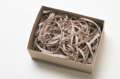 Jupiterimages/liquidlibrary/Getty Images If you spot your cat munching on rubber bands, pica may be to blame.
