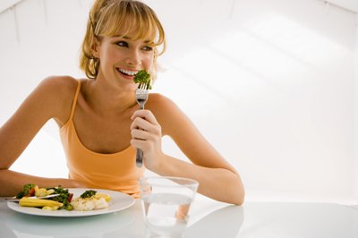 Jupiterimages/Pixland/Getty Images Adjust your calorie intake depending on your goals.