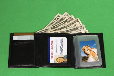 Thinkstock/Comstock/Getty Images Take appropriate identification with you when applying for a debt relief loan.