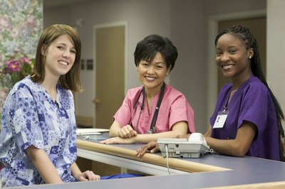 Photodisc/Photodisc/Getty Images A newly graduated RN may have an associate, diploma or bachelor's degree in nursing.