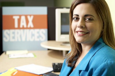 Creatas/Creatas/Getty Images A tax consultant can ease the burden of tax preparation.