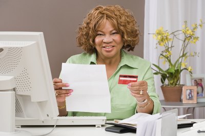 Jupiterimages/Comstock/Getty Images Keep your credit card accounts active to improve your credit score.