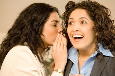 Jupiterimages/Photos.com/Getty Images Gossip can be devastating in the workplace.