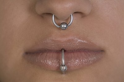 Medioimages/Photodisc/Photodisc/Getty Images People get facial piercings for a variety of reasons.
